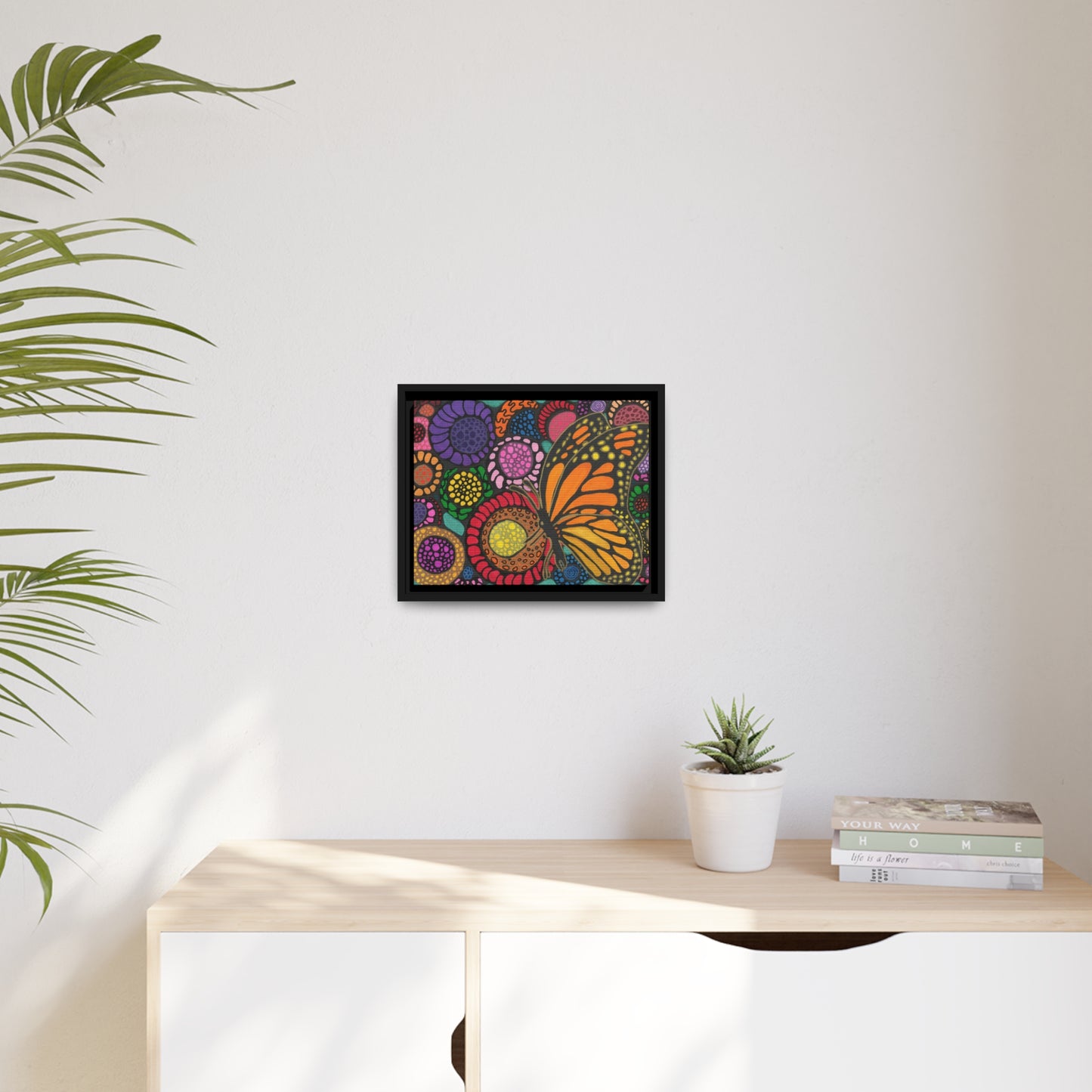 Butterfly with flowers on canvas with black wood frame