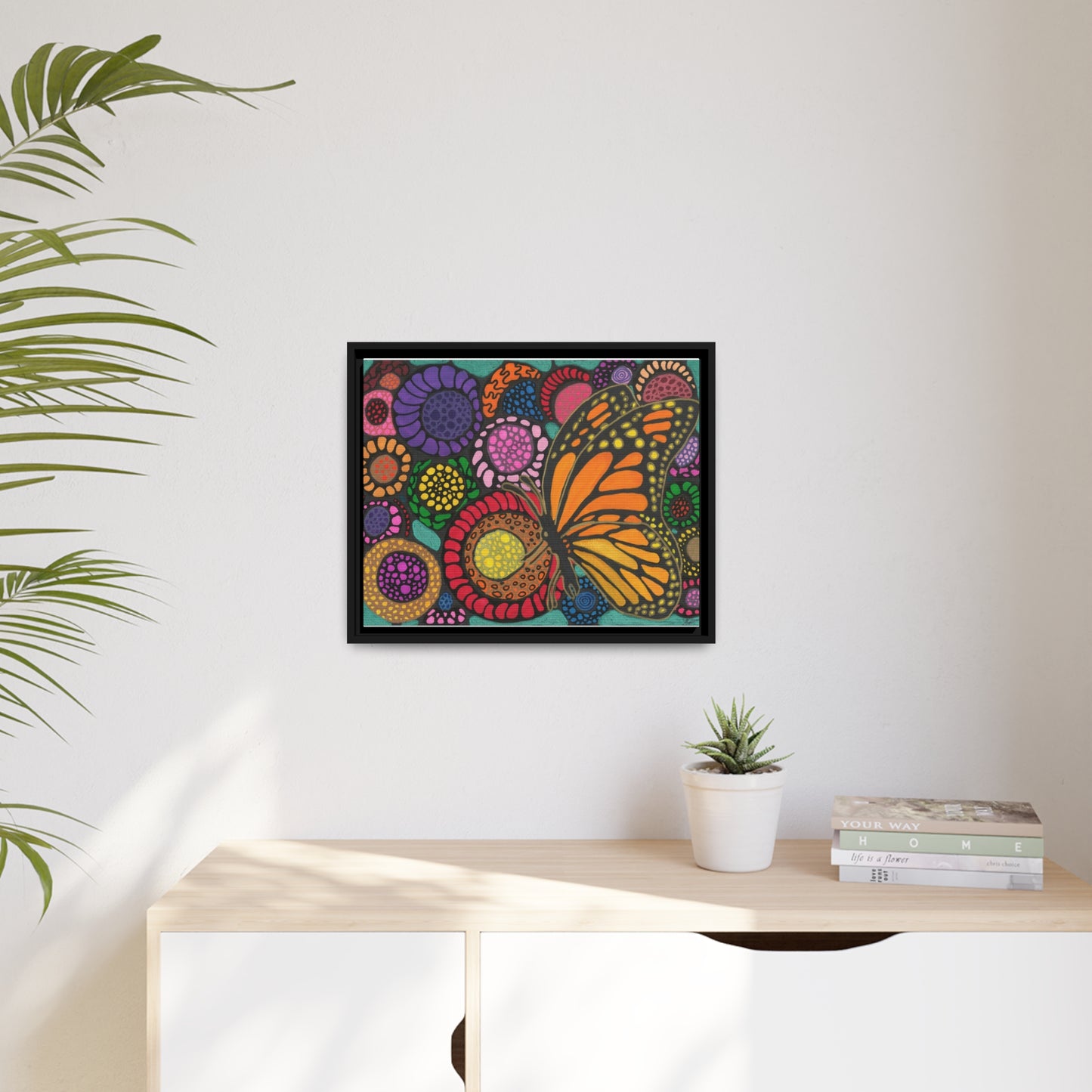 Butterfly with flowers on canvas with black wood frame