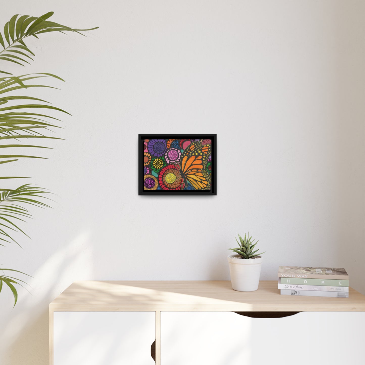 Butterfly with flowers on canvas with black wood frame